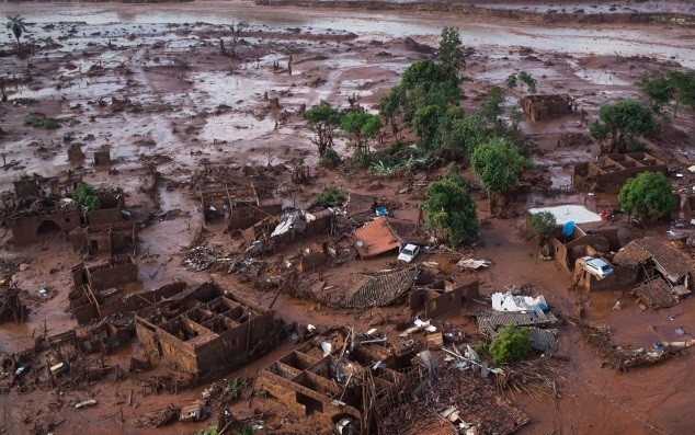 Aerial view of the debris after a dam burst on Thursday, at the small town of Bento Rodrigues in Minas Gerais state, Brazil, Friday, Nov. 6, 2015.  Brazilian rescuers searched feverishly Friday for possible survivors after two dams burst at an iron ore mine in a southeastern mountainous area.  (AP Photo/Felipe Dana)